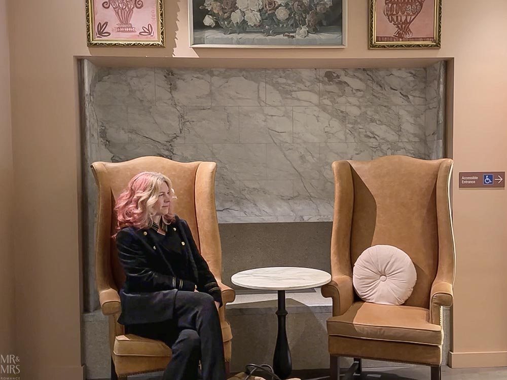 Hotel review of the Porter House MGallery Collection in Sydney - Christina in armchair in lobby