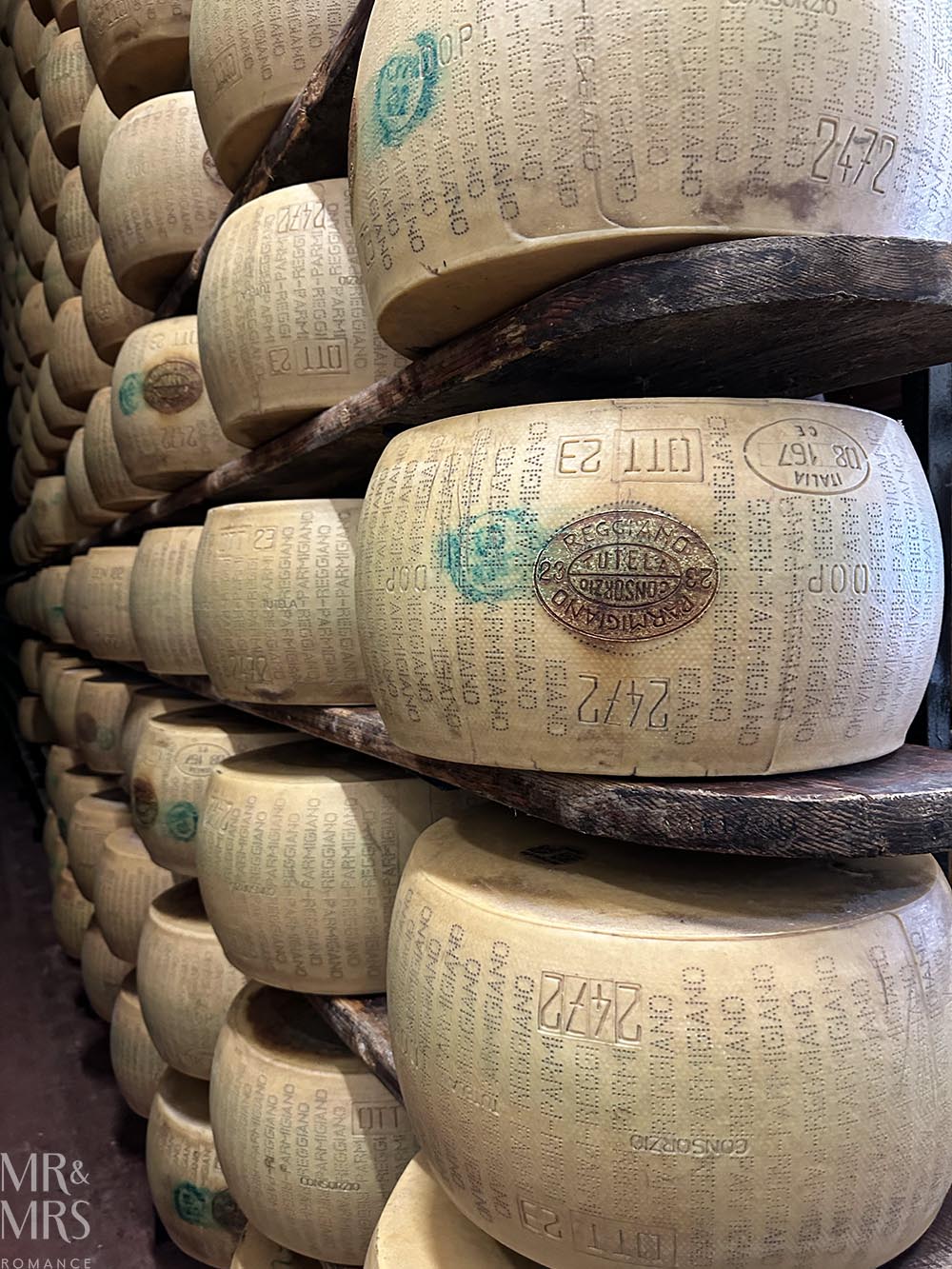 Parmesan with stamps and markings. Tour of parmegiano reggiano parmesan cheese and prosciutto di Parma in Parma Italy