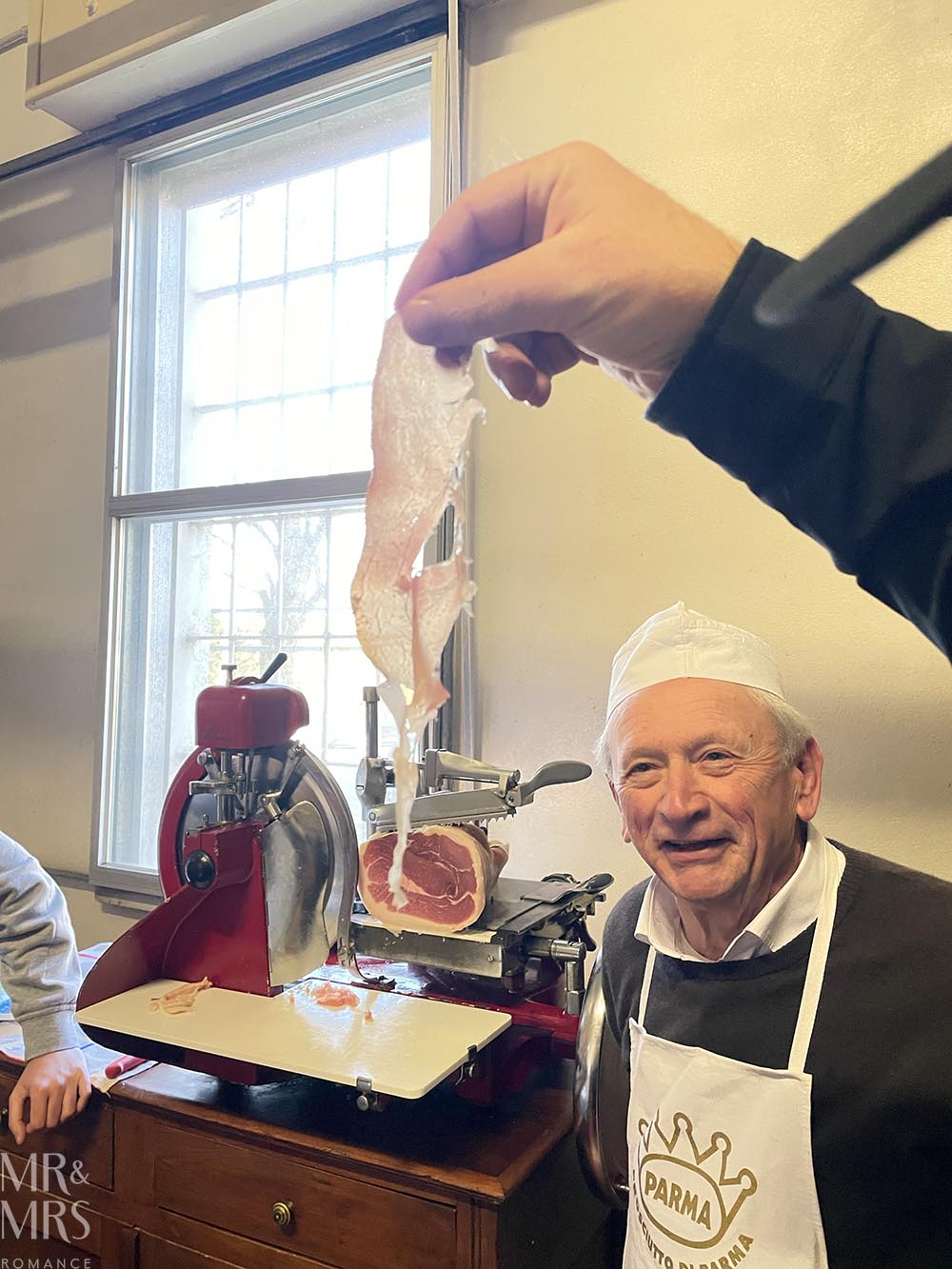 Ham so thin you can see through it. With Alfreddo at Tour of parmegiano reggiano parmesan cheese and prosciutto di Parma in Parma Italy