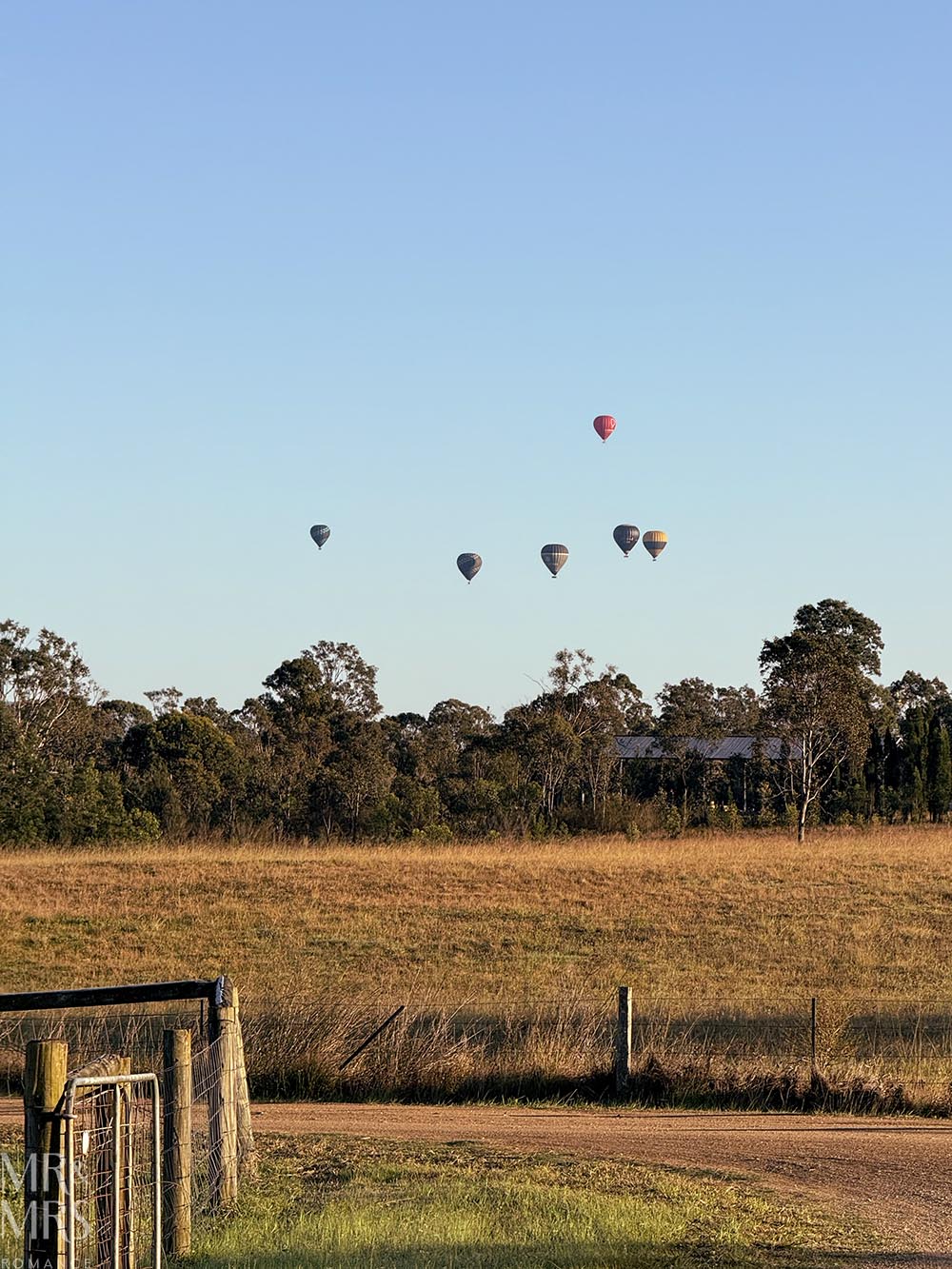 Hot air balloons in the distance. Where to stay in the Hunter Valley / Broke-Fordwich - Villa Vino, Winmark Wines
