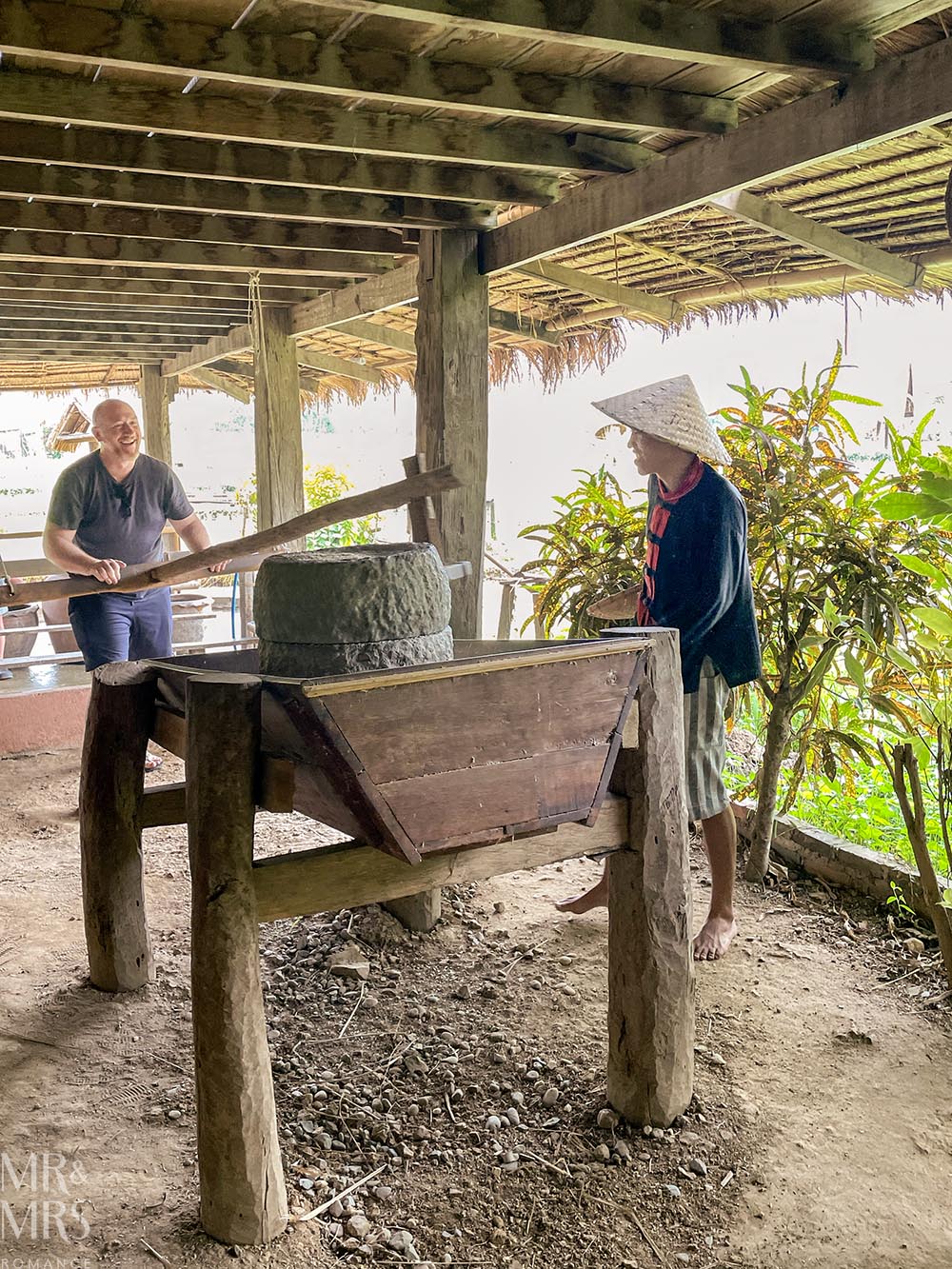 Living Land Farm Company, Luang Prabang, Laos - Jim polishing rice grains