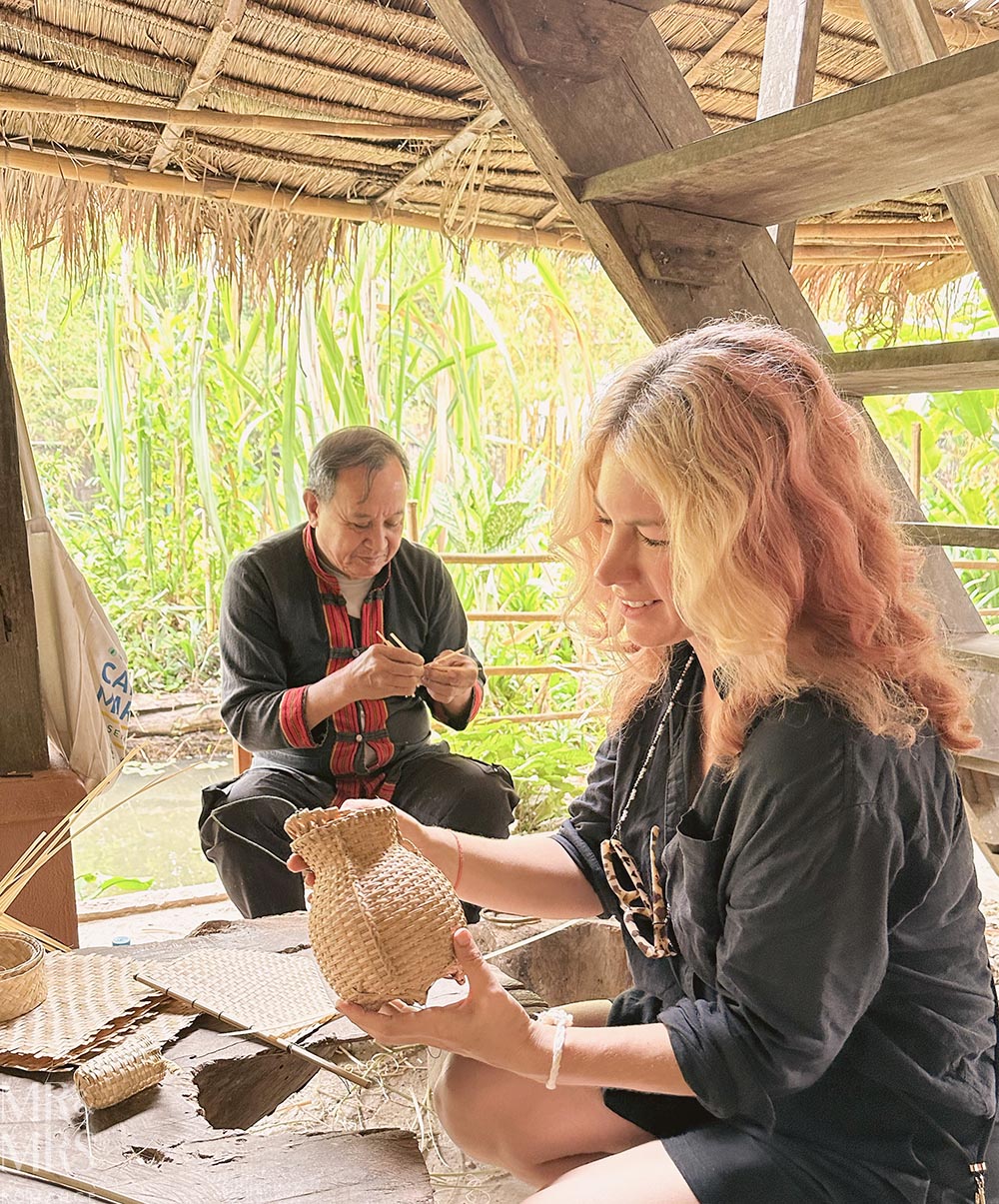 Living Land Farm Company, Luang Prabang, Laos - Christina holding hand-woven bamboo jug