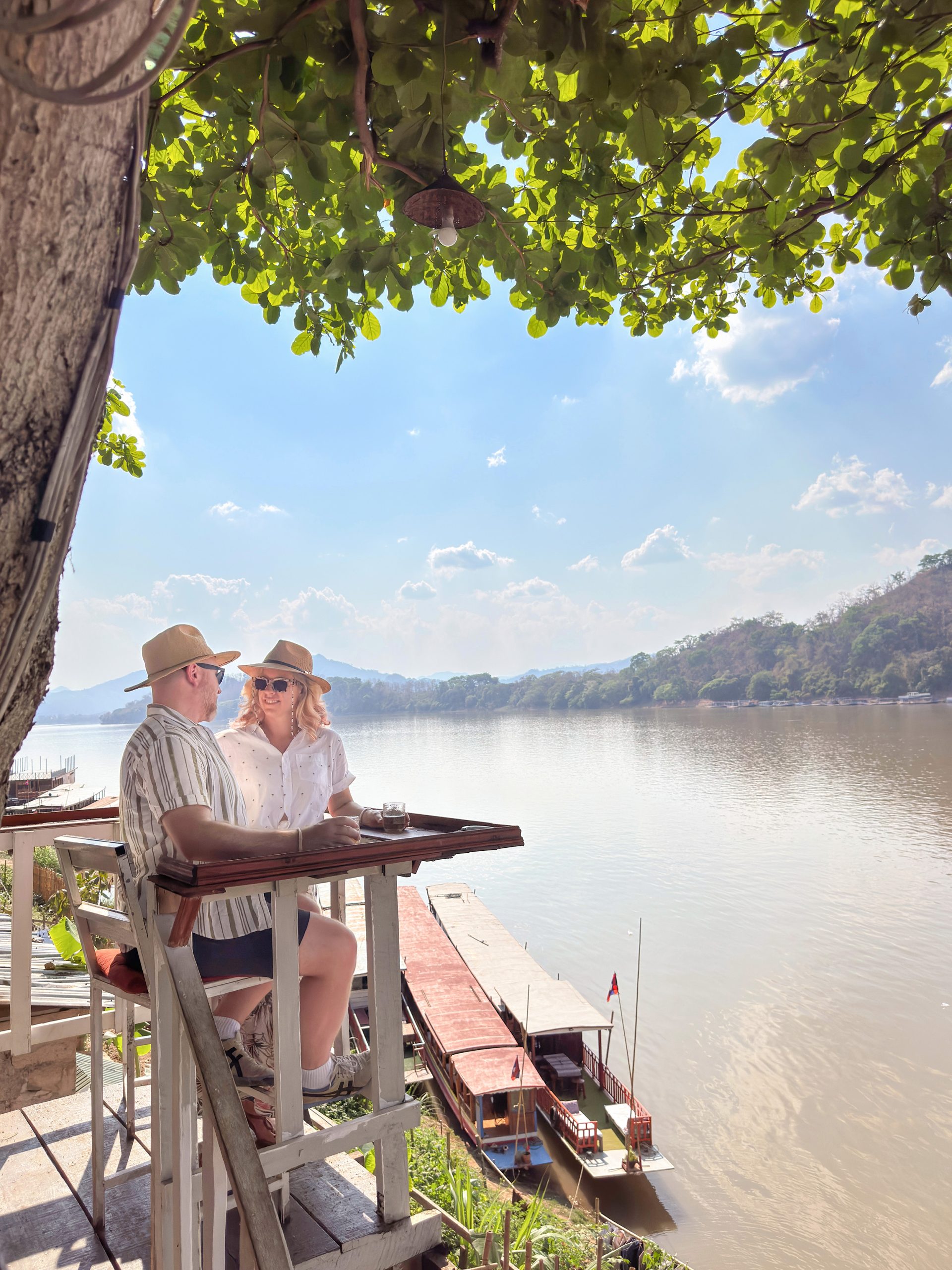 Jim and Christina - Mr and Mrs Romance - at a riverside bar in Laos