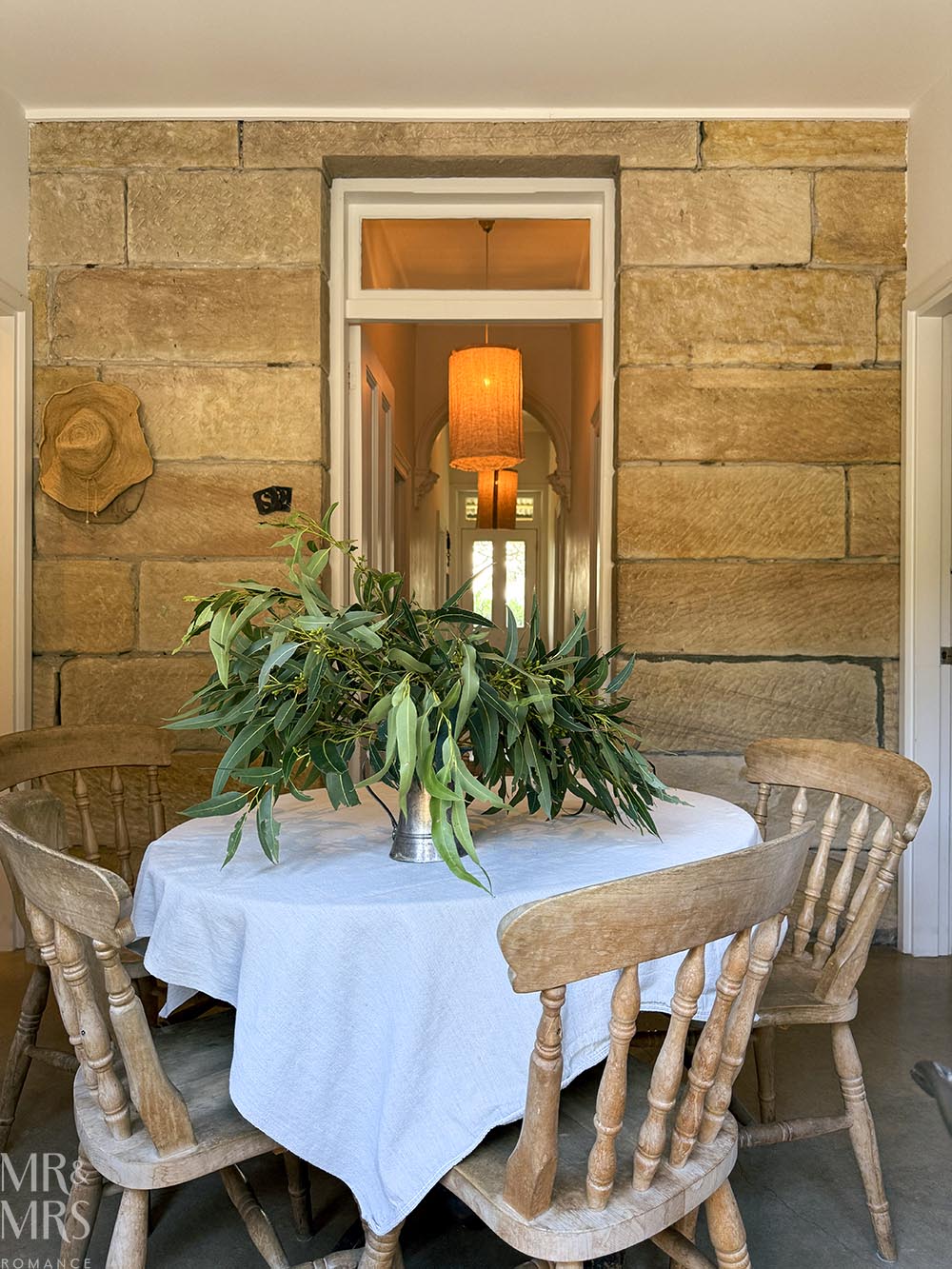 Simpson Cottage Review - dining room table and sandstone wall