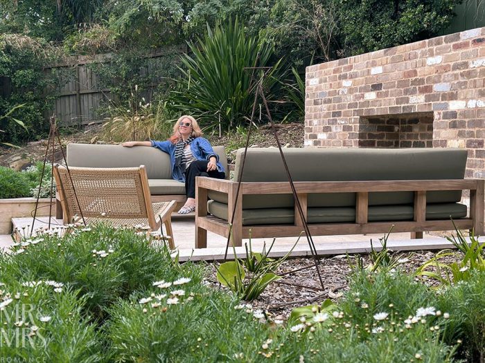 Simpson Cottage Review - Christina on outdoor seating on patio