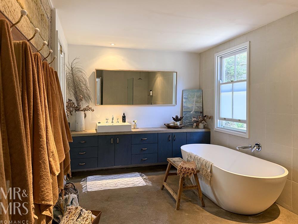 Simpson Cottage Review - bathroom. Big bath, vanity and mirror
