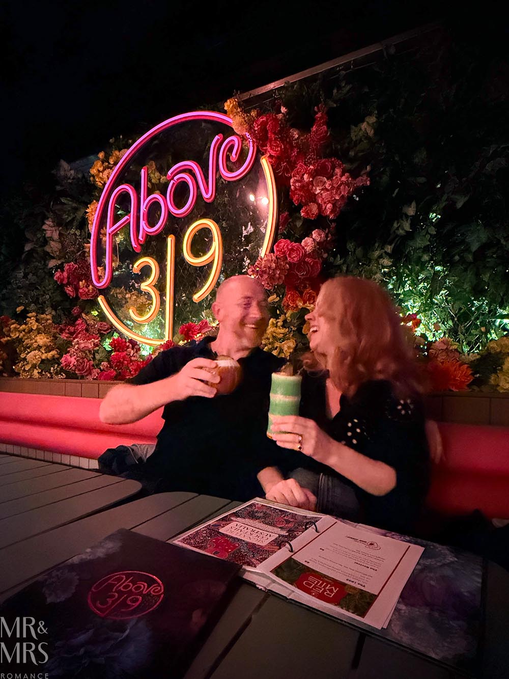 Vibe Hotel Sydney Darling Harbour review - Jim and Christina at Above 319 cheersing and smiling
