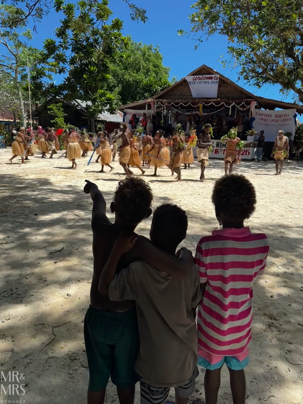 Flavour of the Month - August 2026 - Solomon Islands Shell Money Festival while three children watch on