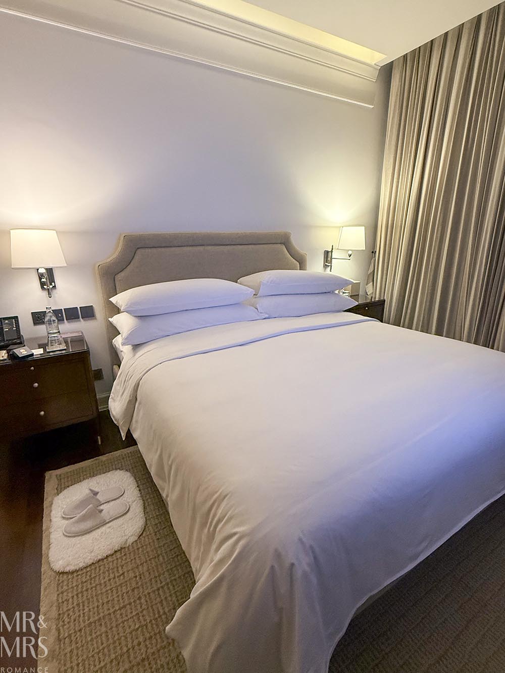 Oriental Residence Bangkok Hotel - huge bed and slippers